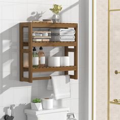 a wooden shelf above a toilet in a bathroom