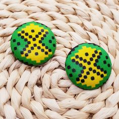 These vibrant authentic African hand-crafted button printed earrings are the perfect addition to your wardrobe and perfect unique gift for her! Sizes: size 60 (1 1/2") 38mm, size 45 (1 1/8") 28mm, size 30 (3/4") 18mm. Color: Yellow, Black & Green Shape: Round Material: Aluminum covered in African Ankara fabric with hypoallergenic stainless steel earring posts. Due to screen resolution, color may appear different than the actual product. Fabric patterns may not look identical due to variances in fabric prints. Each pair may look slightly different from the one pictured, which gives you unique custom beautiful earrings hand-crafted just for you! check out our shop for more African inspired fashion and acces Fabric Button Earrings, Printed Earrings, Earrings Fabric, Jamaican Flag, African Ankara, African Inspired Fashion, Button Earrings, Ankara Fabric, Earring Posts