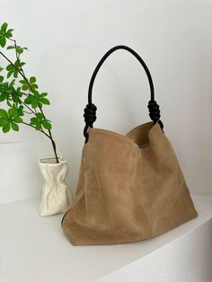 Color: Beige & Coffee Material: Suede Inclusions: dustbag DIMENSIONS: 28cm x 42cm x 10cm(11" x 16.5" x 4") This stunning suede leather tote bag is your perfect companion for any occasion! Whether you're heading to work, traveling, or just out for a stylish day, this handbag effortlessly adds a touch of elegance to your look. Its spacious interior can hold all your essentials, while the soft suede feels luxurious. The shoulder strap ensures comfortable wear, and the knotted handle design adds a c Light Brown Soft Leather Satchel Shoulder Bag, Beige Hobo Bag For On-the-go, Large Capacity Camel Shoulder Bag, Camel Shoulder Bag With Leather Handles, Camel Rectangular Hobo Bag With Large Capacity, Rectangular Camel Hobo Bag In Soft Leather, Camel Rectangular Soft Leather Hobo Bag, Rectangular Camel Soft Leather Hobo Bag, Light Brown Soft Leather Rectangular Hobo Bag