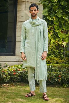 Pastel green kurta with floral chikankari embroidery and mirror work highlights. Comes with matching dupatta and pant.
Components: 3
Pattern: Embroidered
Type Of Work: Chikankari, Mirror
Neckline: Mandarin
Sleeve Type: Straight Full
Fabric: Kurta and Dupatta- Georgette, Pant- Cotton Satin
Color: Green
Other Details: 
Model height: 6ft, wearing size M
Occasion: Sangeet - Aza Fashions Green Sherwani With Mirror Work For Eid, Designer Green Sherwani With Chikankari Embroidery, Pista Green Traditional Wear With Chikankari For Transitional Season, Green Bollywood Sherwani With Chikankari Embroidery, Green Traditional Sherwani With Chikankari Embroidery, Green Sherwani With Chikankari Embroidery, Traditional Green Sherwani With Mirror Work, Green Chikankari Kurta, Rhea Kapoor