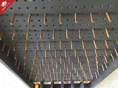 there are many wooden pegs on the ceiling