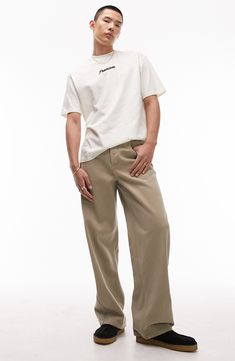 A baggy fit and a khaki wash bring relaxed, '90s-inspired style to these casual-cool nonstretch jeans. 30" inseam; 20 1/2" leg opening; 12" front rise; 16 1/2" back rise (size 32) Button fly Five-pocket style 100% cotton Machine wash, dry flat Imported Men Home Decor, Baby Gear Essentials, Rollerball Perfume, 90s Inspired, Fragrance Design, Fabric Gift Bags, Baggy Jeans, Baggy Fits, Nordstrom Store