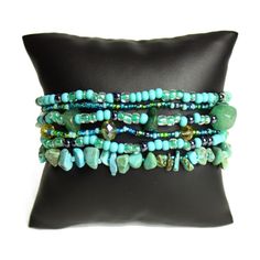 Artisan Czech Glass Beaded 6 Strand Bracelet Cuff Shades Of Turquoise With Glass Beads And Stone Chips The Clasp An Easy To Open/Close Magnetic Clasp. Funky 6 Strand; Length Of 8" Due To The Handcrafted Nature Of This Artisan Bracelet...No Two Bracelets Are Exactly Alike Handcrafted In Guatemala Using Artisan Crafted Czech Glass Beads. Principles Of Fair Trade Are Upheld. Visit Our Posh Closet To See The Entire Enchanted Line Of Earrings,Necklaces & Bracelets Turquoise Gemstone Beaded Bracelets For Festivals, Bohemian Turquoise Stretch Bracelet With Spacer Beads, Hand Wrapped Turquoise Beads For Gifts, Hand Wrapped Turquoise Beads As Gift, Spiritual Turquoise Beaded Wrap Bracelet, Spiritual Beaded Turquoise Wrap Bracelet, Elegant Turquoise Czech Glass Beaded Bracelets, Hand-strung Adjustable Czech Glass Beaded Bracelets, Turquoise Hand-strung Stretch Bracelet For Festivals