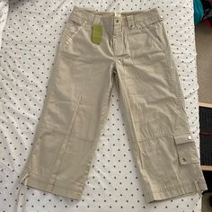 100% Cotton. Women’s Size 4 Capri Pants. Khaki Color. Never Worn With Tags Still On. 5 Pockets. New Condition. Casual Knee-length Pants For Spring, Casual Knee-length Spring Pants, Knee-length Capris With Pockets, Spring Knee-length Pants With Pockets, Spring Cropped Leg Capris With Pockets, Casual Knee-length Pants With Pockets, Fitted Knee-length Capris With Pockets, Khaki Short Pants For Spring, Short Khaki Pants For Spring