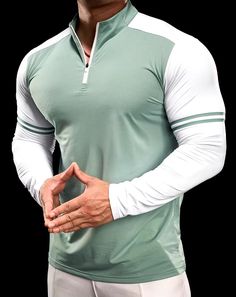 PeakFit Men’s Gym & Fitness T-Shirt Half-zip Sportswear Tops For Light Sports, Green Moisture-wicking Winter Top, Green Crew Neck Sweatshirt For Gym, Winter Sports T-shirt, White Winter Sports T-shirt, Green Winter Gym Tops, White Tops For Outdoor Sports Season, White Winter T-shirt For Sports, White Stretch Top For Outdoor