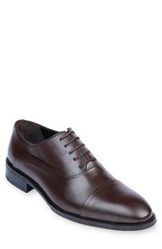 Handmade of smooth leather, this cap-toe dress shoe with a classic oxford silhouette offers a sophisticated, elegant look. Leather upper and lining/synthetic sole Made in Turkey