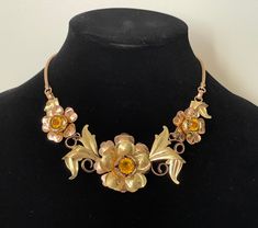 "Rose gold and yellow gold plated, topaz rhinestone floral necklace  Very good condition, vintage, late 1930-s.  Unmarked  approximately - 16 1/4\" with clasp  1 flower diameter - 1 7/8\" and 2 flowers diameter - 1 1/8\"  wt.: 2 oz.  Domestic shipping: USPS First class mail. 1-5 business days. I can file an insurance claim only after 20 business days after item was shipped International shipping: USPS First class mail. Approximately 7-21 business days. I can file an insurance claim only after 40 Vintage Rose Gold Jewelry For Evening, Rose Gold Vintage Jewelry For Evening, Rose Gold Flower Jewelry For Evening, Gold Victorian Necklace For Evening, Victorian Gold Necklace For Evening, Gold Metal Flower Necklace For Wedding, Gold Flower Necklace For Formal Occasions, Vintage Yellow Metal Jewelry, Vintage Gold Rhinestone Necklace Gift