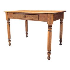 an old wooden table with two drawers on one side and three legs on the other