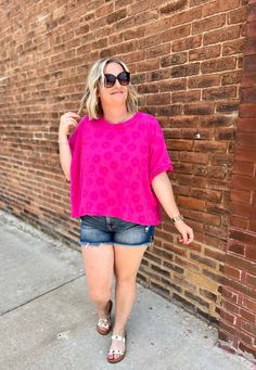 This Fuchsia Flower Top features a unique texture that adds depth and interest to your outfit. Embrace the elevated look and feel of this top while standing out from the crowd. Perfect for any occasion, this top is sure to make a stylish statement. Chic Textured Summer Tops, Trendy Textured Tops For Spring, Casual Textured Summer Blouse, Trendy Crew Neck Pink Blouse, Textured Short Sleeve Summer Blouse, Textured Short Sleeve Blouse For Summer, Chic Pink Crew Neck Top, Casual Textured Tops For Summer, Pink Crew Neck Blouse For Day Out