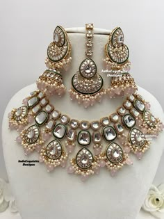 Premium quality Kundan Necklace comes with elegant Jhumki Earrings and Tikka/ trendy Indian bridal set/Premium Quality Polki and Kundan Jewelry/pink All items are shipped from Brampton, Ontario, Canada. If you need your item by a certain day, please reach out to us for express delivery option before placing the order so that we can update the shipping for you. Standard shipping/delivery timeline Below are the delivery timeline estimates. We dispatch all orders by the next business day. ---> USA Elegant Pink Round Kundan Necklace, Pink Chandbali Kundan Necklace With Stone Work, Pink Chandbali Kundan Necklace For Wedding, Bollywood Pink Bridal Necklace For Reception, Bollywood Style Pink Bridal Necklace For Reception, Pink Kundan Jewelry Sets, Pink Kundan Necklace With Meenakari For Reception, Pink Kundan Wedding Necklace With Stone Work, Pink Kundan Necklace For Festivals