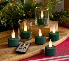 tea light candles with remote control on wooden tray