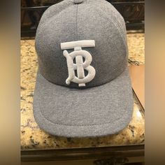 *New* Men’s Authentic Burberry Cap Tb Monogram Motif Jersey Cap Dark Charcoal All Tags Attached. *Never Worn-New* Luxury Flat Brim Baseball Cap With Embroidered Logo, Luxury Baseball Cap With Embroidered Logo And Flat Brim, Luxury Snapback Hat With Embroidered Logo, Luxury Hats With Logo Patch And Curved Brim, Classic Cap With Logo Detail, Luxury Curved Brim Baseball Cap, Classic Hat With Logo Detail And Curved Brim, Classic Hat With Logo And Curved Brim, Classic Hat With Curved Brim And Logo Detail