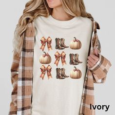 🍂 Embrace autumn vibes with our Cute Fall Pumpkins Boots and Bows T-Shirt! Perfect for a cozy country style, this Western Autumn Graphic Tee combines rustic charm with comfort. Ideal for crisp fall days, this top is sure to become a seasonal favorite. Make a statement and stay cozy! 🍁👢  Comfort Colors 1717 is a fully customizable tee made 100% with ring-spun cotton. The soft-washed, garment-dyed fabric brings extra coziness to your wardrobe while the relaxed fit makes it an excellent daily ch Casual Brown T-shirt For Fall, Trendy Comfortable Fit T-shirt For Fall, Trendy Comfort Fit T-shirt For Fall, Graphic Tee For Fall, Brown Graphic Print T-shirt For Fall, Comfortable Graphic Tee For Fall, Cute Fall T-shirt With Relaxed Fit, Casual White T-shirt For Fall, Brown Letter Print T-shirt For Fall