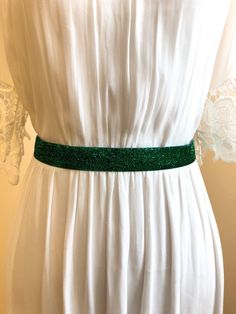 "Perfectly charming for you or your bridal party. This sparkly emerald green belt adds just enough pizazz to brighten up your day. It'll also be super sparkly all day long, from the sun drenched ceremony, to the after-hours dance party! Each belt measures 1\" in width.  Belt is non stretch You should measure around your waist with the dress on. These are so cute on tunics, tanks, and with everyday dresses, too.  Cheers! ♥ ♥ ♥ ♥ ♥ ♥ ♥ ♥ ♥ ♥ ♥ ♥ ♥ ♥  www.etsy.com/LveDve ♥ ♥ ♥ ♥ ♥ ♥ ♥ ♥ ♥ ♥ ♥ ♥ ♥ ♥ Fitted Sashes Bridal Belt For Party, Fitted Bridal Belt With Sashes For Party, Elegant Fitted Green Sashes, Green Headband, Green Belt, Lace Headbands, Bridal Belt, Green Ribbon, Dance Party