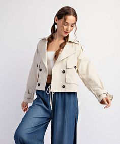 This trench style jacket features a notched collar neckline, button down front, two front chest pockets, wrapped button cuffs and an inverted pleat in the back for detail. Lightweight and comfortable, this jacket is the perfect layering piece to wear year round. 100% cotton Rounded bottom hem, high-low design Model is wearing a size small and is 5'9" Trench Jacket, Belted Shirt Dress, Pink Midi Dress, Floral Print Blouses, Notched Collar, White Tank Top, Floral Midi Dress, Design Model, Clothes Gift