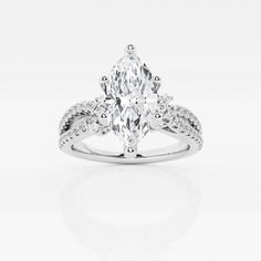 an oval cut engagement ring with diamond accents