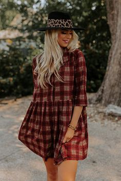 You will surely be in a cherry mood when you wear this charming tunic dress featuring lightweight material patterned with a brown and dark red hued plaid print, a v-cut neckline, loose 3/4-length sleeves, and a relaxed silhouette that falls into a straight mid-thigh length hemline! Measurements S : Bust 44", Hip 50", Length 33", Sleeve Length 15.5", Waist 44". M : Bust 46", Hip 52", Length 33.5", Sleeve Length 16", Waist 46". L : Bust 48", Hip 54", Length 34", Sleeve Length 16", Waist 48". XL : Casual Burgundy Dress For Fall, Long Sleeve Brown Plaid Dress For Fall, Plaid Bohemian Dresses For Fall, Bohemian Plaid Dress For Fall, Bohemian Plaid Fall Dresses, Fall Plaid V-neck Dress, Casual Brown Plaid Dress For Fall, Red 3/4 Sleeve Dress For Fall, Red Half Sleeve Dress For Fall