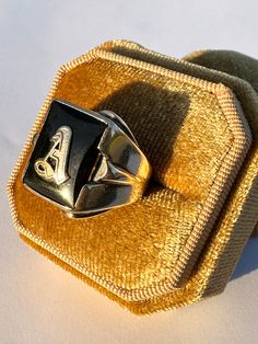 Classic vintage 1940s retro era 10k yellow gold genuine onyx letter "A" ring! This timeless statement ring has a 10k yellow gold setting, that contains a genuine onyx  gemstone. There is an old English letter "A" in the center. A fantastic piece of fine 1940s era personalized jewelry!  ERA - Circa 1940s / Retro  METAL / MATERIAL - 10k yellow gold, genuine onyx MARKINGS / HISTORY - 10k  CONDITION - Good vintage condition. Yellow gold metal has been polished & cleaned. Age appropriate patina & wea Vintage Signet Ring With Initials, Vintage Formal Initial Ring Hallmarked, Vintage Gold Initial Ring With Polished Finish, Vintage Formal Signet Ring With Initials, Vintage 14k Gold Initial Ring, Vintage 14k Gold Initial Ring Stamped 14k, Vintage 14k Stamped Initial Ring, Vintage 14k Gold Initial Ring For Formal Occasions, Vintage Engraved Ring With Hallmarks