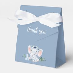 a blue gift bag with an elephant on it and the words thank you in white lettering