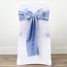 the back of a chair with a blue bow on it