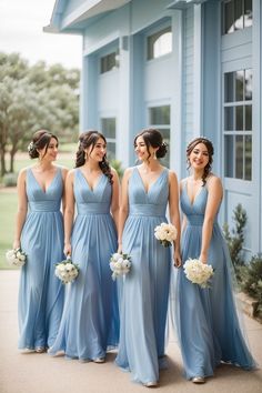 the bridesmaids are all wearing blue dresses