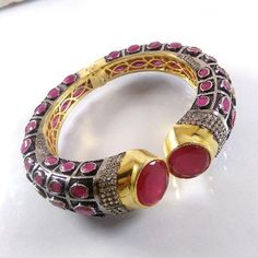 This Listing is for 1 Piece Beautiful Red Aventurine & CZ Hydro Gemstone Gold Plated Cuff Bangle Bracelet Jewelry Gemstone: Red Aventurine & CZ Metal : Brass  Style : Cuff Bracelet  Size : Cuff Adjustable Size Plating : Gold Plated & Black Oxidize  Color : Yellow,White, Black  Note : We Ship Parcel Via India Post Economy Shipping It's Take 20 To 25 Days To Arrive. Check my other items frequently. I will be adding to the inventory regularly. Be sure to visit my shop to check for any coupon codes Handmade Ruby Bangle Bracelet, Adjustable Jeweled Bangle As Gift, Jeweled Round Bangle As Gift, Round Stone Bangle As Gift, Stones Bangle Gift, Stones Bangle For Gift, Red Bangle Jewelry With Jewels, Unique Jeweled Bangle Bracelets, Stone Bangle Cuff Bracelet For Gift