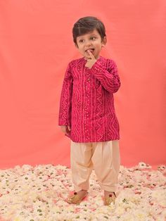 VASTRAMAY SISHU Boys' Pink Bandhni Kurta And Patiala Set Dress your little one in style and tradition with this vibrant pink kurta patiala set. Featuring a beautiful bandhani print, the kurta boasts a comfortable relaxed fit and a mandarin collar. The set comes complete with cream colored patiala pants for a complete and festive look. Key Features Pink Bandhni Print Mandarin Collar Kurta Relaxed Fit Cream Patiala Pants Elasticated Waistband for Comfort Specifications Material: Kurta - Rayon, Pat Pink Salwar Kameez For Diwali, Pink Dabka Kurta For Diwali, Pink Dabka Sets For Festivals, Pink Bollywood Style Kurta For Festivals, Pink Long Sleeve Sets For Diwali, Pink Straight Kurta Sherwani For Diwali, Cotton Pink Salwar Kameez For Festivals, Pink Cotton Salwar Kameez For Festivals, Pink Sherwani Straight Kurta For Diwali