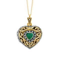 This genuine emerald locket necklace features a heart-shaped emerald at its centre. Our vintage-style locket opens to reveal two of your favourite photos inside.  DETAILS:  * Genuine emerald gemstone beautifully cut to show off the light-reflecting properties of the stone.  * Crafted in 18 carat gold vermeil and surrounded by a collar of marcasite.  * Can be personalised with two of your favourite photos for a truly personalised gift.  * Hallmarked with a full UK Hallmarked in the Edinburgh Assa Vintage Emerald Necklace As A Gift, Vintage Emerald Necklace Gift, Vintage Emerald Necklace For Gift, Antique Green Locket Necklace, Vintage Emerald Pendant Necklace As Gift, Vintage Emerald Pendant Necklace Gift, Vintage Green Heart-shaped Jewelry, Vintage May Birthstone Necklaces For Anniversary, Vintage May Birthstone Necklace For Anniversary