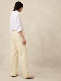 Easy and lightweight, this relaxed pant balances sharp tailoring with the lived-in look of linen.  We crafted this pair in a beautiful Italian fabric that blends luxurious linen with soft, silky  TENCEL™ lyocell.  Plus, we hid a bit of elastic at the back waistband for a custom fit.  Mid rise (9. 75"), wide leg.  Full length.  Fabric from Italy's Olimpias mill.  Sustainability: Made with TENCEL™ lyocell, a sustainably sourced fiber from responsibly-harvested trees.  Zip fly with hook-and-bar clo Relaxed Trousers, Petite Shorts, Butter Yellow, Luxury Linen, Italian Fabric, Petite Size, Custom Fit, Casual Pants, Banana Republic