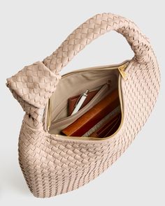 This Italian Leather Handwoven Slouchy Shoulder Bag is the epitome of luxury and style. Handcrafted from the finest Italian leather, this bag features a clean handwoven design that adds a touch of sophistication to any outfit. The slouchy silhouette gives it a relaxed and effortless vibe, perfect for everyday use or special occasions. With ample space and two pockets for all your essentials, this shoulder bag is both practical and chic. Make a statement with this versatile piece that will elevate your look and stand the test of time.  | Quince | Women's Italian Leather Handwoven Slouchy Shoulder Bag in Taupe Woven Leather Bag, Sheep Leather, Quince, Leather Working, Italian Leather, Leather Bag, Zip Pockets, Dust Bag, Hand Weaving