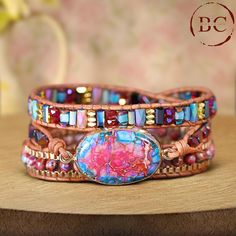 This popular jewelry piece features a Natural Stone Pink Jaspers Beaded Leather Wrap Bracelet, designed for a distinctive boho flair. The bracelet showcases beautifully strung pink jasper beads, known for their vibrant and calming hues, wrapped around a supple leather strap. With its triple-layered design, it offers a bold and stylish statement, perfect for adding a touch of elegance to any outfit. Ideal for women who appreciate both bohemian style and natural beauty, this bracelet is also a great choice for yoga enthusiasts and makes for a thoughtful friendship gift. Its versatile design seamlessly blends artisanal craftsmanship with contemporary charm, making it a standout accessory for any jewelry collection. Adjustable Bohemian Bracelet With 108 Beads, Bohemian Leather Bracelet With Natural Stones For Gift, Bohemian Leather Bracelet With Natural Stones As Gift, Adjustable Bohemian Wrap Bracelet, Bohemian Bracelets With 108 Beads For Jewelry Making, Bohemian Leather Bracelet With Natural Stones, Bohemian Beaded Crystal Bracelet For Festivals, Multicolor Beaded Spiritual Leather Bracelet, Adjustable Bohemian Crystal Bracelet For Festivals