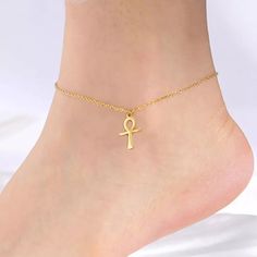 Step into timeless elegance with our Stainless Steel Ankh Cross Anklet/Bracelet, a stunning tribute to ancient Egyptian symbolism. Adorn your ankle or wrist with this exquisite piece featuring the iconic Ankh Cross, symbolizing life and eternal existence. Infuse your look with ancient mystique and grace, making a statement that resonates with the rich heritage of Egypt. Metals Type: Stainless Steel Length: 21+5cm Item Type: Anklets Color: steel / gold color We ship worldwide to 185 countries! Pl Egypt Ankh, Cross Anklet, New Egypt, Egyptian Ankh, Ankh Cross, Leg Chain, Antique Pendant, Anklet Bracelet, Anklet Jewelry