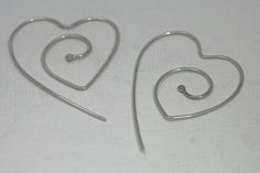 Sterling silver wire heart earrings heart eco by CapturedIllusions, $24.00 Handmade Gift Hoop Earrings In Silver Plated Wire, Handmade Silver Double Heart Earrings, Silver Handmade Double Heart Earrings, Handmade Minimalist Heart Earrings, Handmade Silver Heart Pendant Earrings, Handmade Silver Heart Earrings For Valentine's Day, Open Heart Ear Wire Earrings As Gift, Nickel-free Open Heart Hoop Earrings Gift, Nickel-free Double Heart Sterling Silver Hoop Earrings