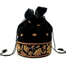 "Look your best wearing this luxurious black velvet bucket bag potli bag, exquisitely embroidered with glittery metallic copper flowers and embellished with genuine semi precious stones. It is certain to bring you compliments. Perfect for Indian wedding or for going on the town! Expertly hand embroidered by third generation master zardozi artisans. Of exceptional quality. - 9\" x 6\", useable interior space 6\" x 6 \". - Rigid bottom and 2\" base, so bag sits nicely. - Wrist cord with tassel, 6 Velvet Pouch Bag, Bollywood Style Embroidered Evening Potli Bag, Traditional Evening Pouch For Festivals, Elegant Black Bucket Bag For Gift, Evening Pouch With Zari Work For Festivals, Luxury Handmade Potli Bag For Festivals, Traditional Potli Bag With Gold Embroidery For Formal Events, Traditional Formal Potli Bag With Gold Embroidery, Evening Zari Work Potli Pouch Bag