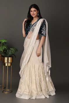 Off-white lehenga with a detachable drape having beads and thread hand embroidered borders. Comes with a navy blue jaal work padded blouse. - Aza Fashions Drape Lehenga, White Lehenga, Padded Blouse, Embroidered Border, Lehenga Saree, Beaded Neckline, White Velvet, Blouse For Women, Saree With Blouse