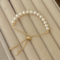 This bracelet is a must-have for your bracelet stack, it is simple for daily wear also would be great for matching your pretty dresses! Great for all occasions. This style is also a great gift for a friend or loved one. 🤍Material🤍 5-6 mm Freshwater Pearls 18K Gold Filled Adjustable bracelet 💛Great For All Occasions  💛Freshwater Pearls 💛18K Gold Filled 💛Hypoallergenic  💛Tarnish Free 💛Gift For Her 💛Birthday Gift 💛Christmas Gift 💛Free Domestic Shipping  🤍 Freshwater Pearl 🤍  The unique features of freshwater pearls, from their origin in freshwater sources to the variety of colors and affordability, make them a standout and accessible choice for stylish and creative jewelry designs🌟 🤍 Packaging 🤍 If you purchase for your loved ones, and wanted to make it look like a nice gift, Classic Adjustable Hypoallergenic Pearl Bracelet, Dainty White Bracelets With Adjustable Length, Dainty White Bracelet With Adjustable Length, Elegant Beaded Bracelets With Sliding Knot, Elegant Beaded Bracelets With Sliding Knot For Gifts, Resizable Pearl Bracelet With Round Beads For Gifts, Minimalist Adjustable Bracelet As Gift For Her, Dainty Adjustable Pearl Bracelet Gift, Adjustable Classic Pearl Bracelet For Everyday