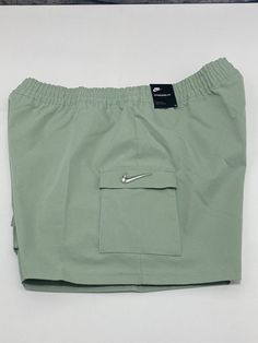 Nike Green Activewear For Outdoor, Sportswear Shorts With Pockets For Streetwear, Sportswear Streetwear Shorts With Pockets, Nike Green Moisture-wicking Bottoms, Nike Sports Shorts With Side Pockets, Nike Athletic Shorts With Pockets, Nike Sportswear Shorts With Side Pockets, Nike Cargo Sports Shorts, Nike Sporty Shorts With Cargo Pockets