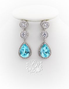 This bridal necklace and earrings set features exquisite Top quality 23mm Swarovski Light Turquoise Teardrop Crystal, brilliant Cubic zirconia, platinum plated components and rhinestones. and pear cut pendant 3 inches backdrop. Sparkling 23mm Swarovski Light Turquoise Teardrop Crystal and daisy rhinestones elegantly dangle from ear posts. The zirconia are set in rhodium plate surrounding rhinestones. This gorgeous jewelry set will look elegant and beautiful quality on any classic or vintage insp Teardrop Aquamarine Jewelry For Formal Occasions, Aquamarine Teardrop Jewelry For Formal Occasions, Formal Teardrop Aquamarine Jewelry, Turquoise Cubic Zirconia Jewelry Gift, Turquoise Crystal Jewelry For Gifts, Turquoise Crystal Jewelry Gift, Teardrop Aquamarine Jewelry For Anniversary, Elegant Turquoise Round Jewelry Sets, Hand Set Blue Jewelry Sets For Wedding