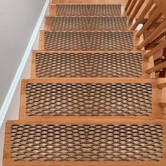 the stair treads are made from wood and have fish scales on them, as well as hand - woven rugs