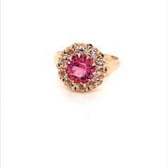 Vintage 1940's 10k yellow gold pink stone ring. The center stone is the color of a gorgeous pink sapphire. The size of the ring is a 5.75, and has the ability to be resized. Classic Pink Ruby Ring With Accent Stones, Classic Pink Ruby Ring With Halo Setting, Pink Sapphire Ring With Halo Setting For Formal Occasions, Fine Jewelry Pink Cluster Ring With Accent Stones, Classic Pink Round Cut Sapphire Ring, Pink Formal Cluster Ring With Prong Setting, Classic Pink Cluster Ring With Halo Setting, Classic Pink Ruby Ring For Formal Occasions, Classic Pink Gold Rings With Center Stone