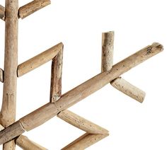 a wooden structure made out of sticks on a white background