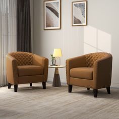 two brown chairs sitting next to each other in a room with white walls and curtains