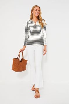 An ideal style for running errands, grabbing lunch with friends, or shopping around town, the Navy Stripe Manon Popover is effortless and oh-so-classic. This top boasts bracelet-length sleeves, a front lace-up tie closure, and a striped pattern that you cannot go wrong with. Pair with denim shorts and sneakers or with pants and sandals for an easy everyday look. V-neckline with front lace-up closure Bracelet-length sleeves Boxy fit Striped pattern Material: 70% Cotton, 30% Polyester Care: Hand w Versatile Stretch Blouse For A Day Out, Chic Stretch Blouse For Everyday, Chic Everyday Stretch Blouse, Casual Stretch Blouse For Day Out, Casual Stretch Blouse For Fall, Casual Fall Blouse, White Casual Blouse For Casual Gatherings, Fall Casual Blouse For Casual Gatherings, Nantucket Basket