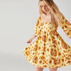 Bohemian Festival Flowy Retro Orange Dresses For Brunch, Yellow Retro Mini Dress, Retro Orange Dress For Brunch, Retro Spring Mini Dress For Brunch, Retro Mini Dress For Brunch, Retro Yellow Mini Dress For Spring, Retro Yellow Mini Length Dress, Yellow Floral Print Dress With Square Neck, Yellow Retro Dress For Vacation