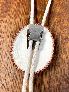 Soft leather, bead and agate bolo tie with stamped silver end tips. Artisan made with extraordinary detailed bead work. Hang length 18" Bolo 2"(w) x 2 3/8"(h) Tassels 2” long Condition: Very good. One tassel is slightly bent. Handmade Adjustable Western Bolo Ties, Southwestern Adjustable Bolo Tie With Sliding Knot, Handmade Adjustable Bolo Ties For Rodeo, Western Style Adjustable Beaded Jewelry, Handmade Adjustable Bolo Tie For Rodeo, Adjustable White Artisan Jewelry, Adjustable Artisan White Jewelry, Handmade Bohemian Bolo Tie, Handmade Southwestern Lariat Bolo Tie