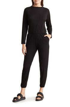 Go casual in this one-and-done jumpsuit fashioned with an elastic blouson waist and cinched elastic hems. Crewneck Long sleeves 90% modal, 10% spandex Hand wash, dry flat Made in the USA of imported fabric Model stats: 5'10" height, 32" bust, 25" waist, 36" hip. Model is wearing size Small. Versatile Jumpsuits And Rompers For Loungewear With Elastic Waistband, Black Elastane Jumpsuits And Rompers For Loungewear, Casual Black Jumpsuits And Rompers With Elastic Waistband, Stretch Solid Jumpsuits And Rompers With Elastic Waistband, Versatile Jumpsuits And Rompers With Elastic Waistband, Stretch Jumpsuits And Rompers With Elastic Waistband, Relaxed Fit Jumpsuit With Elastic Waistband For Loungewear, Black Jumpsuits And Rompers With Elastic Waistband For Work, Overall Jumpsuits And Rompers With Elastic Waistband For Loungewear