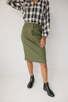 Our bestselling 'Leah' Skirt is now here in a beautiful olive shade! Modesty. Comfort. Style. This denim midi skirt has it all... stretch, cotton fabric and a timeless button-fly closure! We love that the simple lines of the 'Leah' skirt add a touch of class to any outfit. Designed by us with you in mind, we think you are going to fall in love with this skirt as much as we did! 97% Cotton 3% Spandex Machine Wash Cold Do Not Bleach Hang to Dry Low Iron if Needed do not Dry Clean Model Height 5'10 Modest Denim Skirts, A Line Skirt Outfits, Denim Skirt Outfits, Stretch Cotton Fabric, Denim Midi Skirt, Skirts Online, Low Iron, Comfort Style, Simple Lines