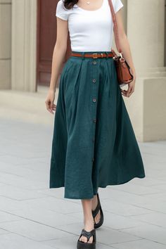 Showcase your style in a sophisticated mid-calf A-line skirt, beautifully tailored in a lush shade of green. The skirt features a distinctive button detail that adds a unique touch. Ideal for the blooming season of spring, this skirt is a perfect addition to any plus size wardrobe.  DETAIL * 100% Linen * Two side pockets * Back elastic waist * Button front skirt * Below Knee Length * Midi skirt  * A Line skirt * Perfect for Spring, Summer and Autumn * Wash by hand or machine with cold water * Mo Summer A-line Skirt With Button Closure, A Line Skirt Outfits Summer, Knee-length Summer Skirt With Button Closure, Summer Knee-length Skirt With Button Closure, Buttoned A-line Skirt, Summer Wide Leg Maxi Skirt With Button Closure, Casual Full Skirt With Button Closure, Summer Midi Skirt With Button Closure, Elegant Maxi Skirt With Button Closure For Summer