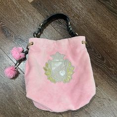 Used Good Condition Vintage Velour Bag By Juicy Couture, Light Pink, Gray Handle With Gold Hardware, Magnetic Closure, Inside Has One Zip Pocket And One Slip Pocket, Very Cute ( Some Pen Mark Inside ) Please Expect Normal Wear, ( Some Wear On Handle ) See Pictures For Additional Information. Designer Pink Bag With Dust Bag, Designer Pink Bags With Dust Bag, Luxury Pink Bag For Daily Use, Luxury Pink Shoulder Bag For Travel, Luxury Pink Shoulder Bag With Removable Pouch, Luxury Pink Shoulder Bag, Pink Handheld Bucket Bag, Designer Pink Bag With Removable Pouch, Designer Pink Bags With Removable Pouch