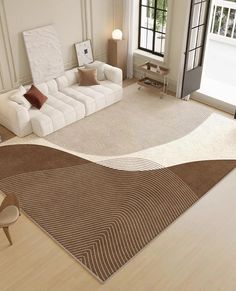 a living room filled with furniture and a large rug on top of a hard wood floor